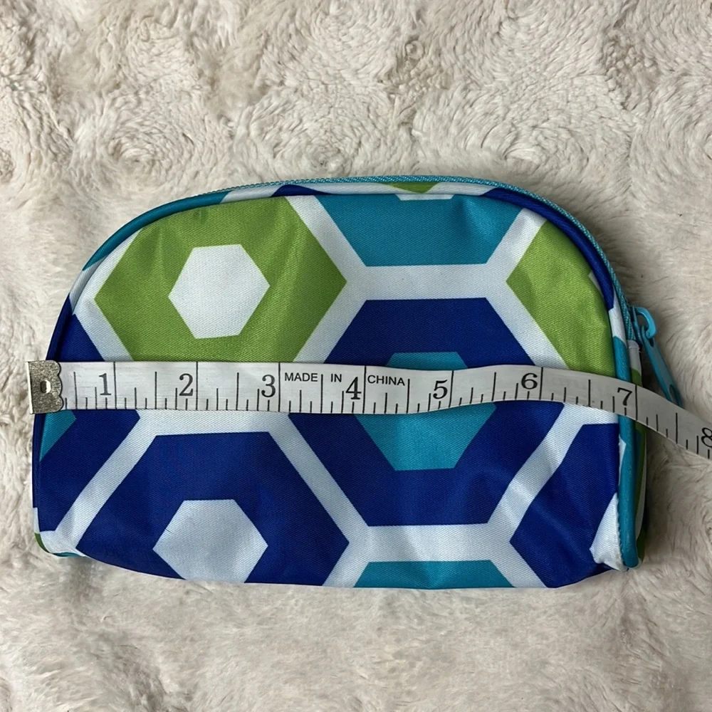 Small cosmetic bag with zip top closure.